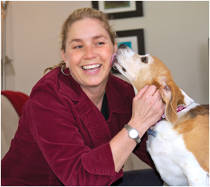 Associate Professor Dawna Komorosky, shown here with her beagle, Carly, is committed to educating the community about relationship violence and its connection with animal abuse. (By: Stephanie Secrest) 